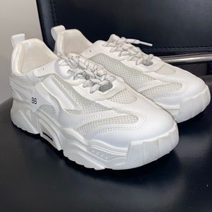 white sneakers , they’re sold as a 9 but definitely would fit an 8 better